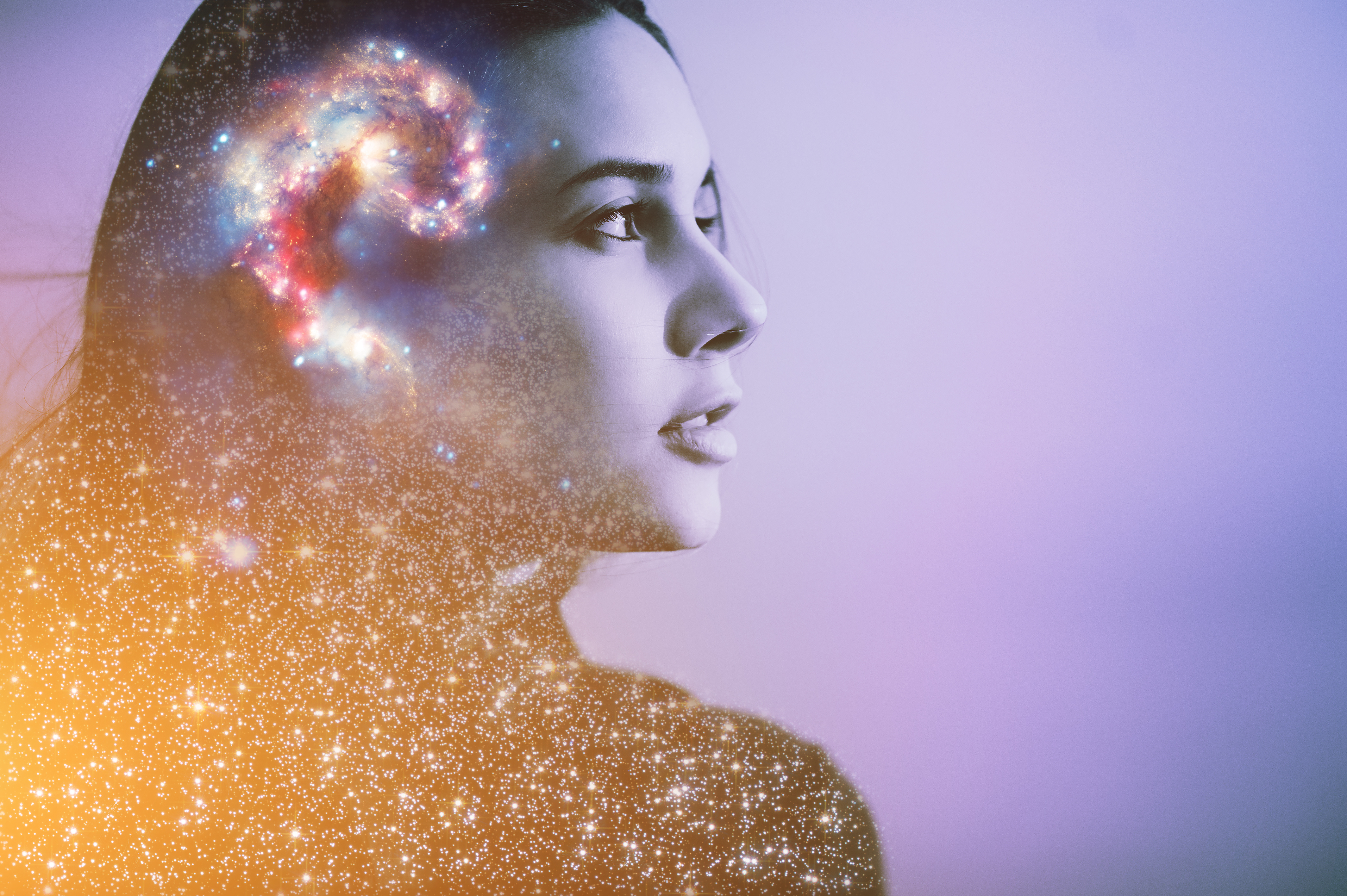 Photo-illustration: at left, a woman's face in profile. The portrait has a heavy blue tint, and images of stars and a galaxy are overlaid across the woman's hair and shoulders.