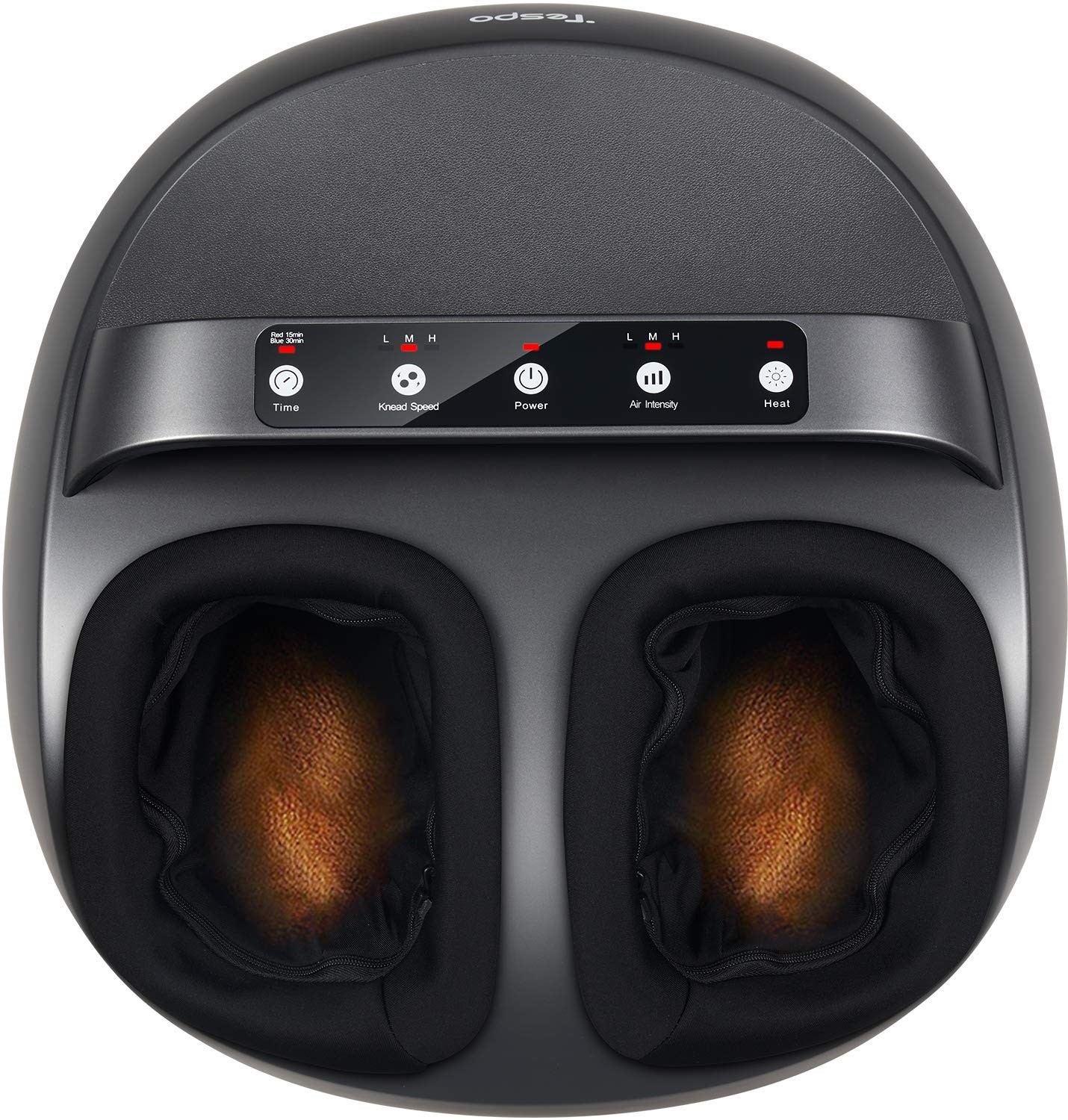 Top view of black, rounded machine with a row of buttons across the top and spaces to insert feet below.