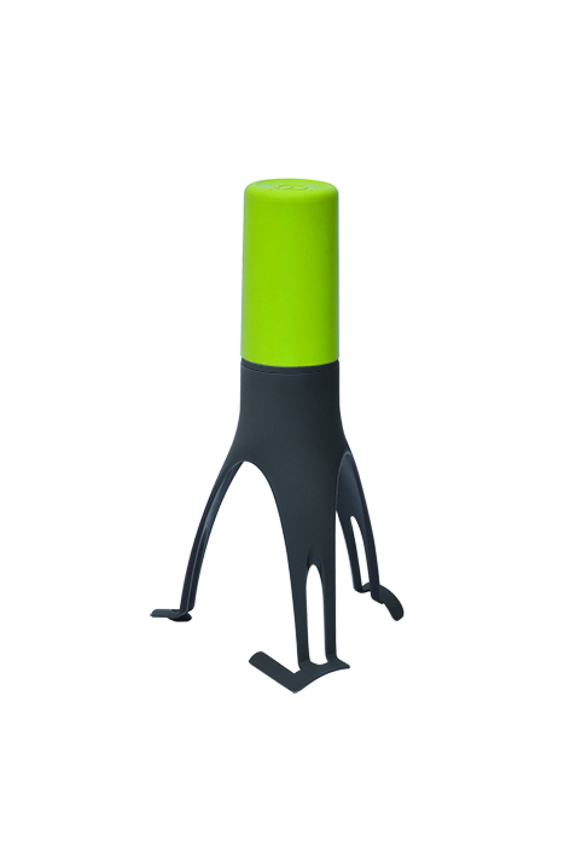 Black kitchen gadget standing upright on three legs, with bright, light green handle at top.