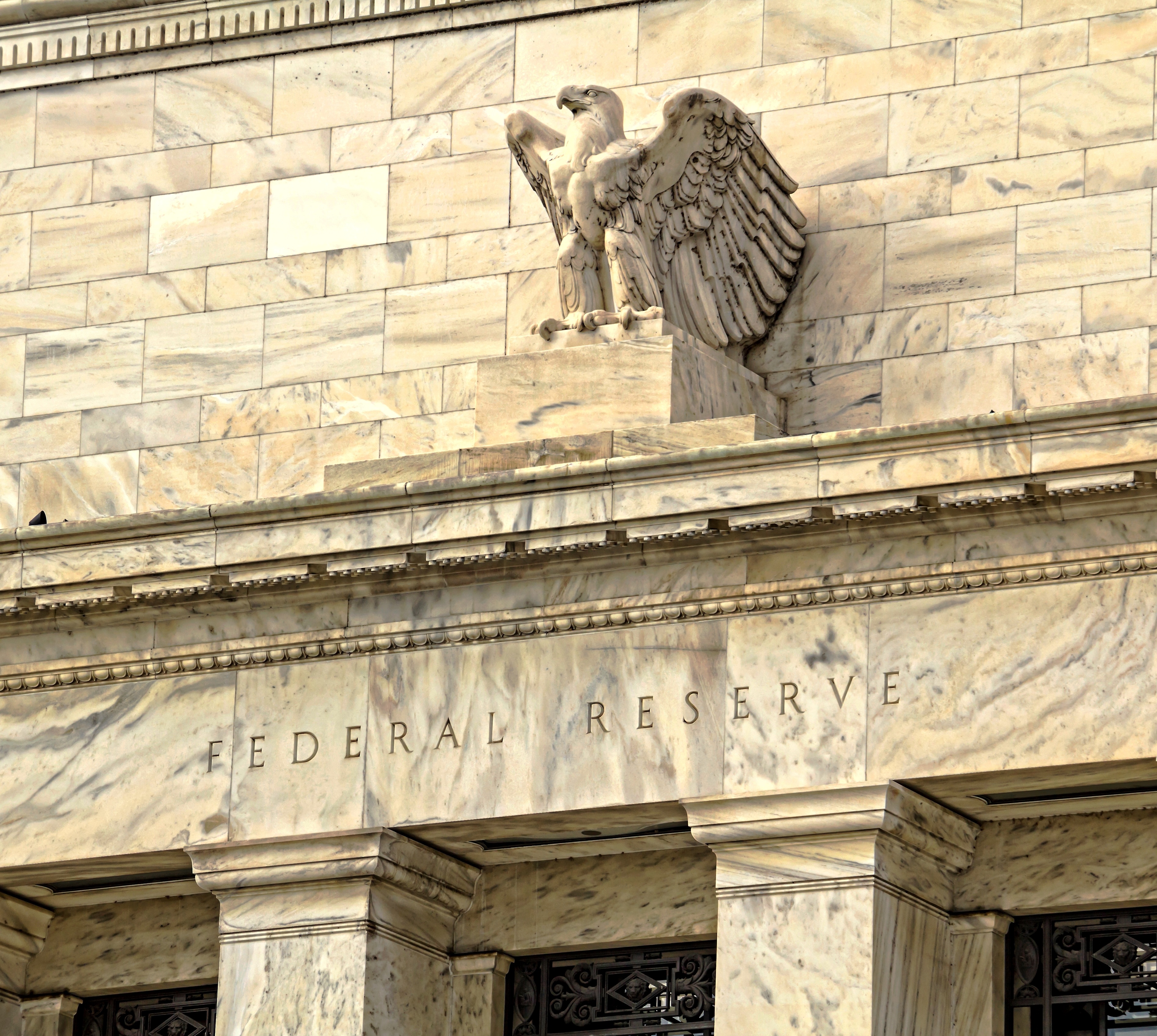 Stone sculpture of an eagle on the Federal Reserve building in Washington D.C.